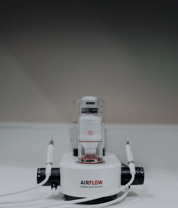 A close-up image of an Airflow Prophylaxis Master dental tool.