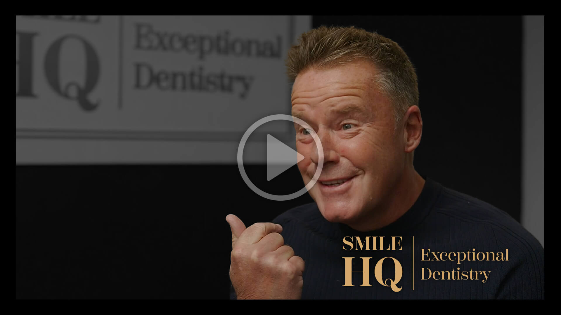 Man smiling during a Smile HQ Exceptional Dentistry video interview.