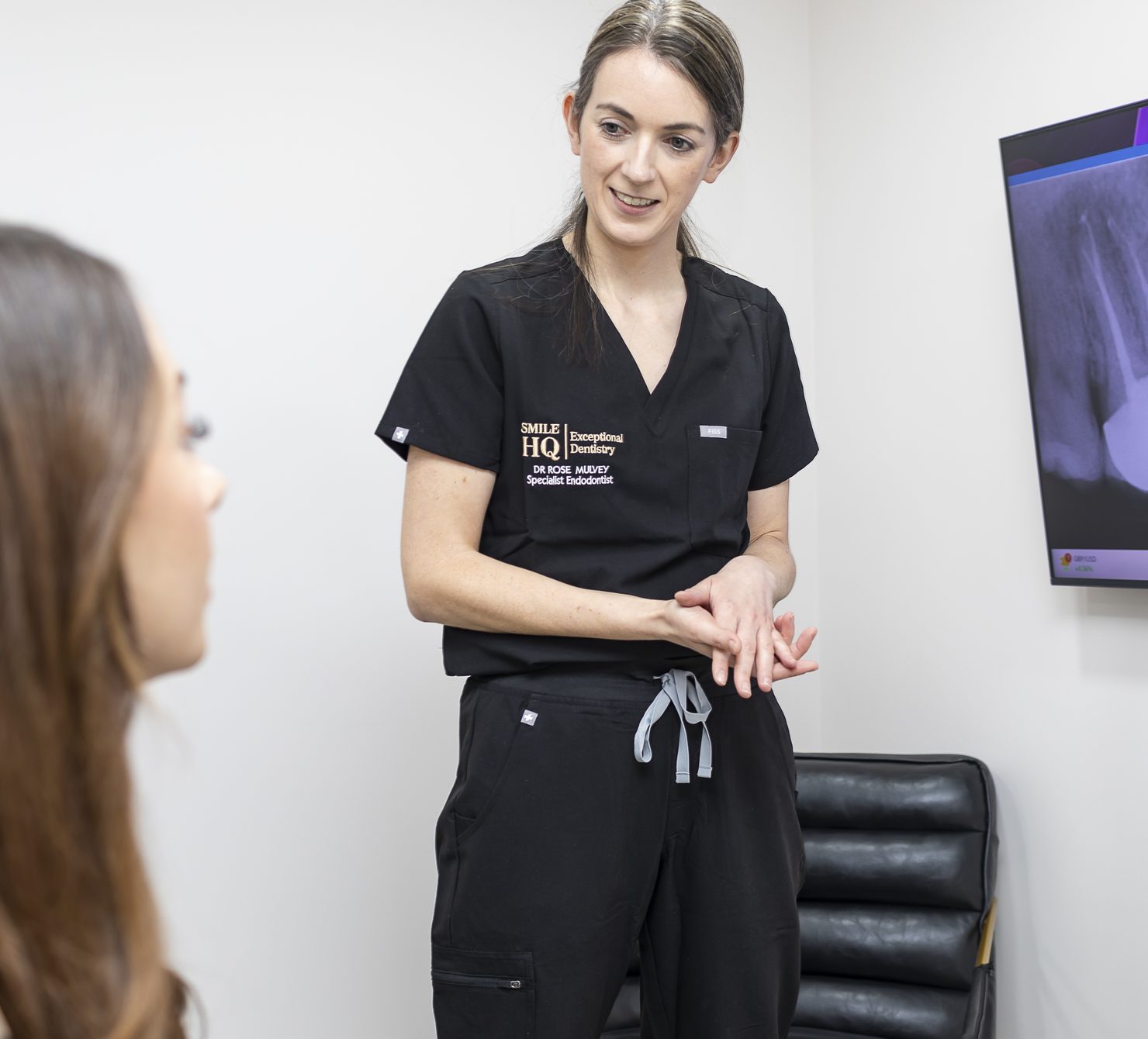 SmileHQ Health Care dentist talking with a patient at 27 High Street, Brentwood